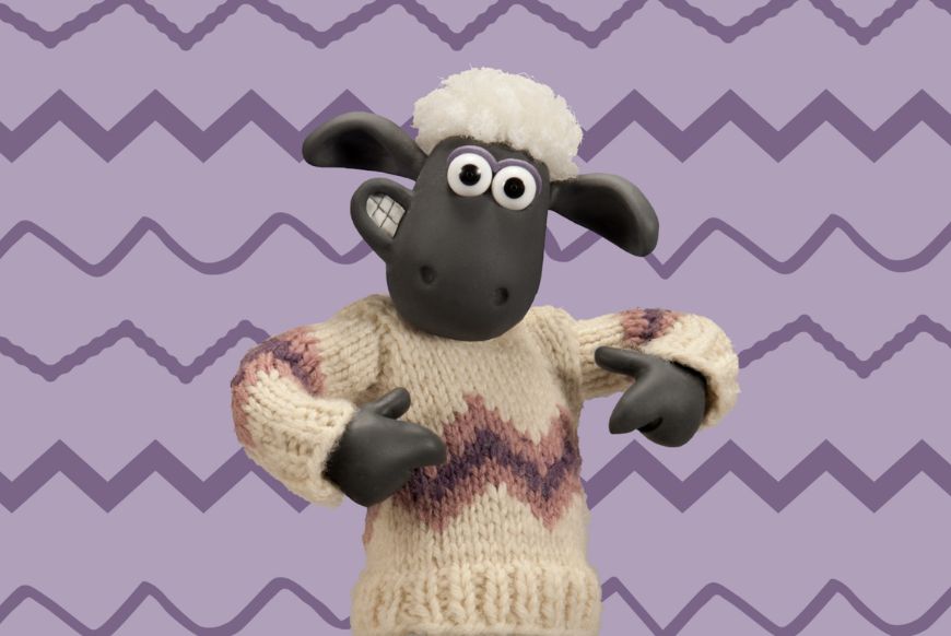 Shawn the sheep in a knitted sweater, pointing at it, ith a purple zig zag background